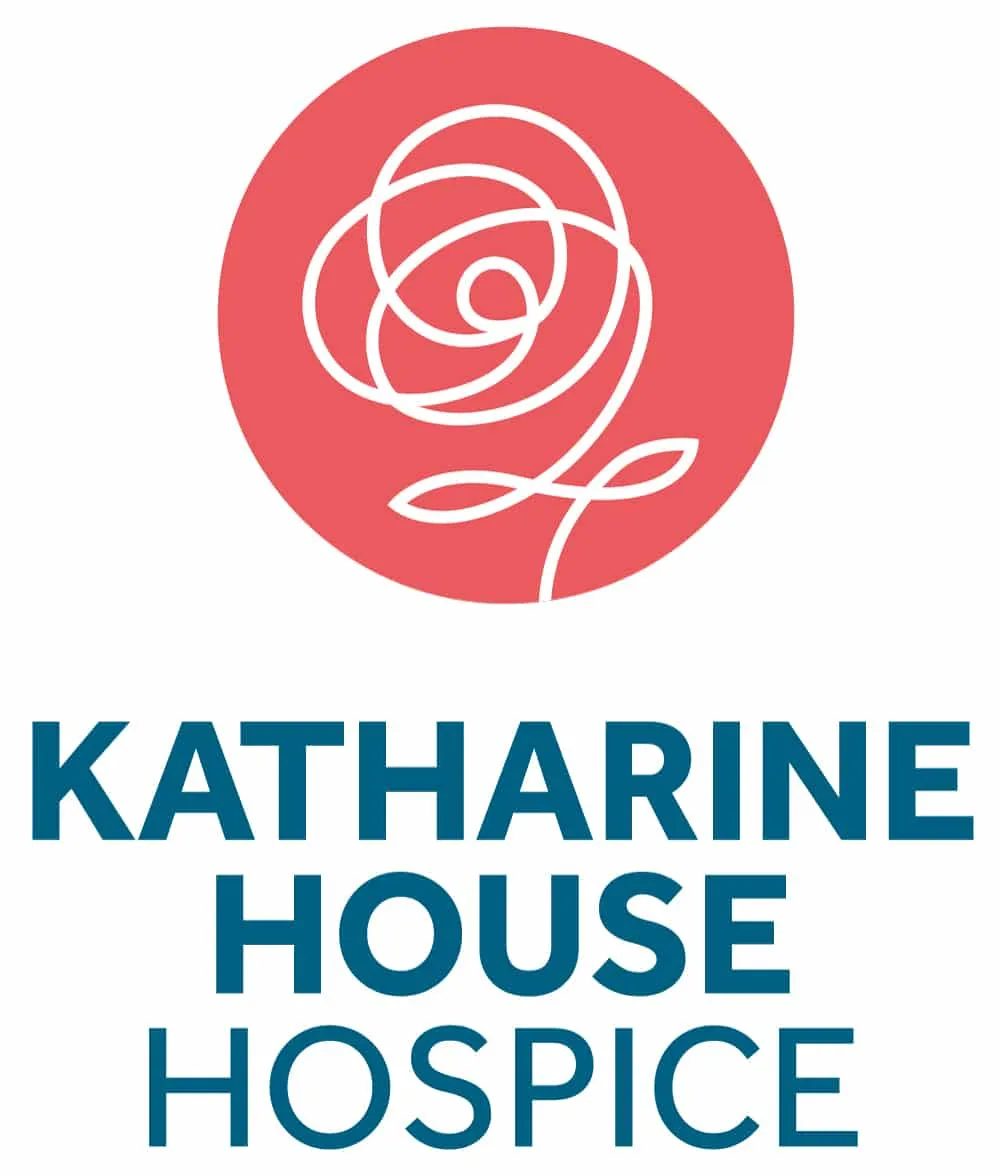 KHH_Logo_Portrait_RGB_2021 Red circular logo with a white rose and the text "Katharine House Hospice" below.